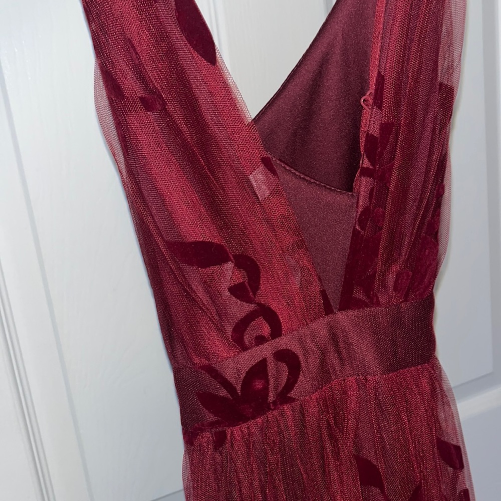 Burgundy Maxie gown / side slid mesh overlay with floral design. Fashion Nova